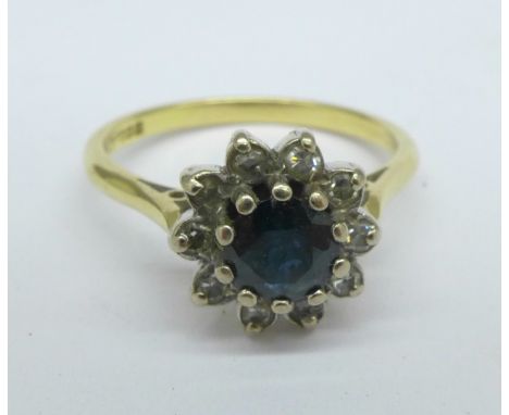 An 18ct gold, sapphire and diamond cluster ring, 3.8g, P