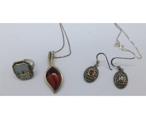 A silver pendant and chain, earrings and a silver ring set with opal