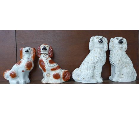 A pair of large Staffordshire spaniels and two matched Staffordshire spaniels, 38cm