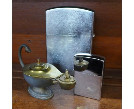 A Dunhill lighter in the form of a lamp, a/f, and two other table lighters including one large novelty