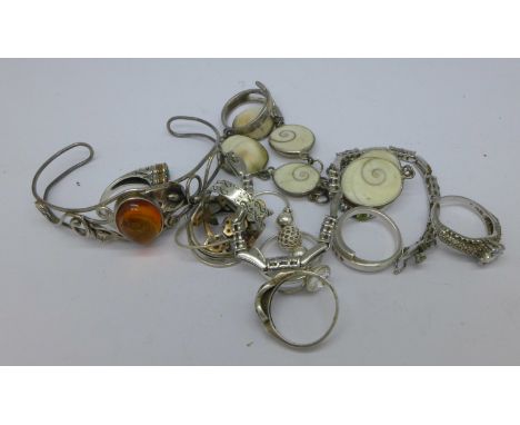 Nine silver rings, bangle, and three bracelets