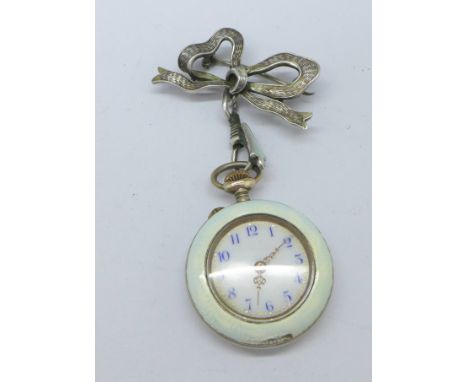 A lady's silver and enamel fob watch with decorative case and silver bow brooch, enamel a/f