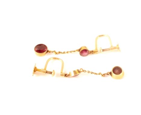 A pair of 9ct gold screw back drop earrings set with red stone