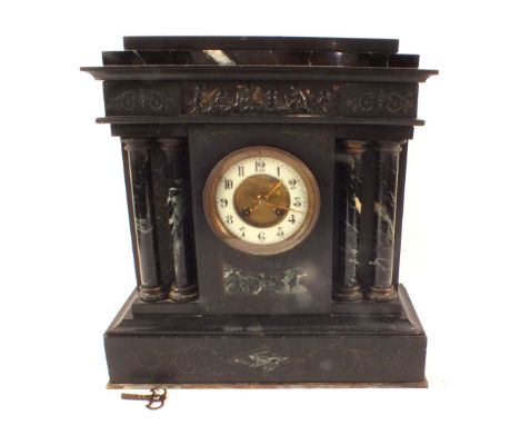 A black slate and marble column mantel clock with enamel dial