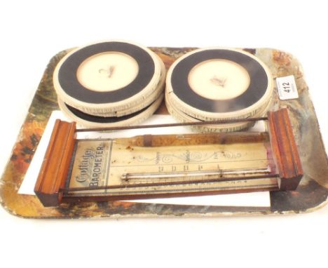 A Victorian tin plate cottage barometer plus six glass place mats inset with trout flies