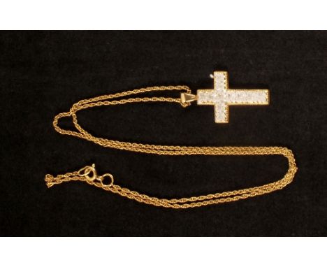 A 9ct gold two colour cross pendant with etched flower design on 9ct gold chain