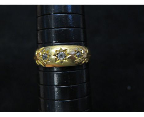 18ct gold ring set with 3 brilliant cut diamonds. Each diamond approx 1/18 carat. 4.1 grams Size R