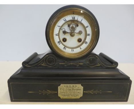 Belgian slate mantle clock, striking on a bell. Presented to P.G John Moxham, dated April 2nd 1877. length 50 cm