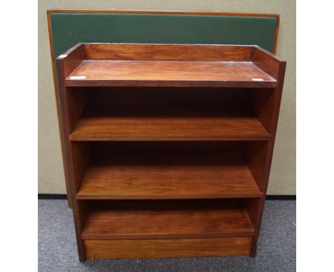 A folding card table and a mahogany bookcase