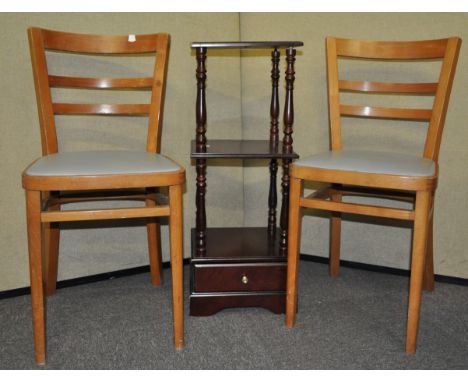 Two chairs and a shelf unit