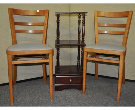 Two chairs and a shelf unit