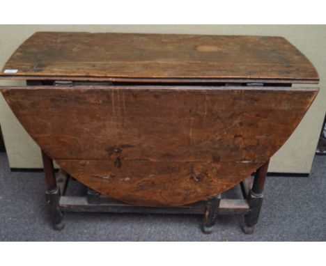 An 18th century elm gate leg table