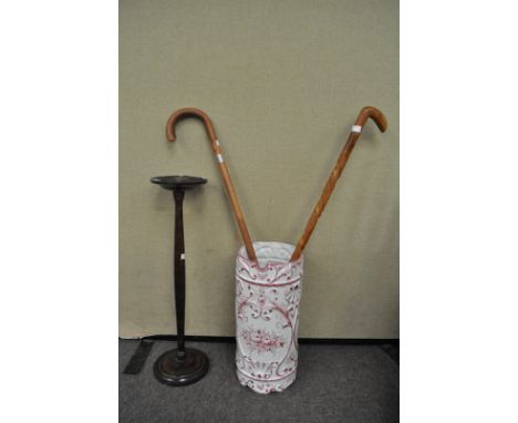 An umbrella stand and walking stick