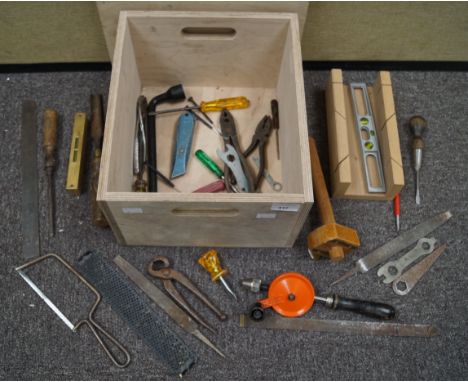 A wooden box with lid and sundry tools