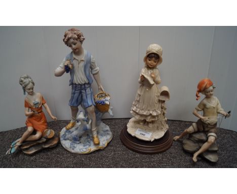 A Capo di Monte boy and girl and two other figures