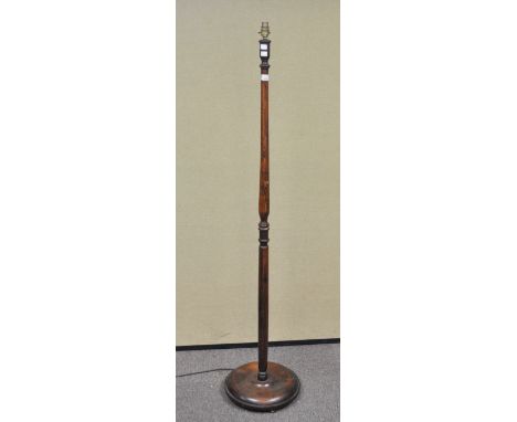 An oak standard lamp on round base, 158cm high