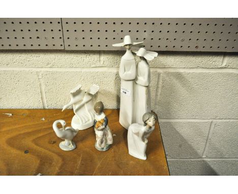 Four Lladro figures and as Royal Doulton 'Going Home' figure