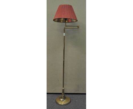 A brass standard lamp with folding arm, 150cm high