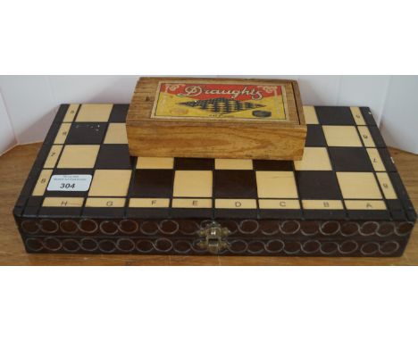 A picture of a cat, four other pictures and a chess set with board