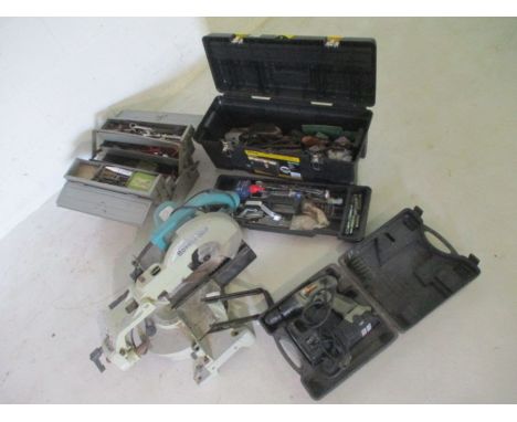 An assortment of various tools including a Boschmann mitre saw etc.