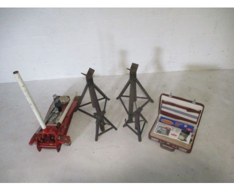 A small collection of auto related tools and a set of kitchen knives