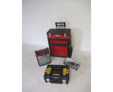 A collection of tools including a DeWalt drill set with impact and percussion driver plus batteries and charger, appears to b