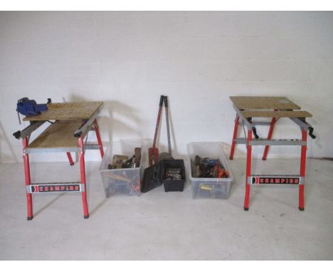 A large collection of tools including two work benches 
