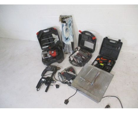 A collection of various power tools including Black &amp; Decker, tile cutters, Mouse sander etc.