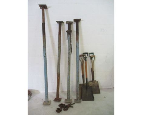 Four acro props along with a quantity of shovels