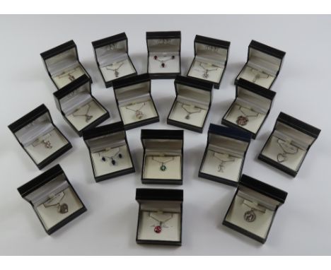 Four initial pendants and chains - F, F, R and M; a 21 pendant and chain; two earrings & pendant sets and ten other pendants 