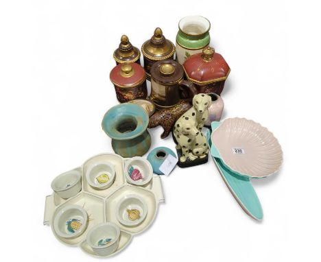 A Poole pottery hors d'oeuvres dish, a shell shaped dish and other Poole items; a pottery figure of a bear and various other 