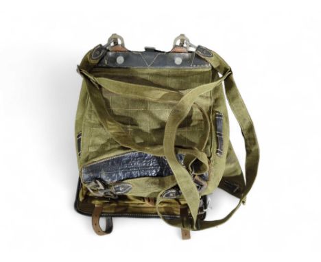 A German knapsack or tornister by H Ruby & Co Hachenburg, marked 1941, green canvas and leather straps, with a pony fur front