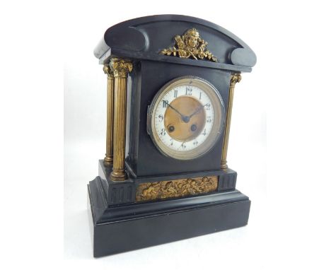 A late 19th century French black slate mantel clock, eight day drum movement, chimes on the half hour, the white enamel chapt