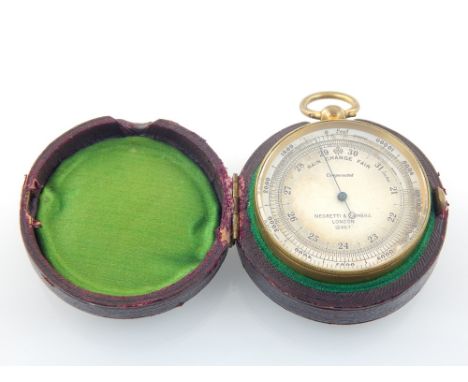 An early 20th century Negretti & Zambra gilt metal pocket barometer combined compass, the circular silvered dial numbered 124
