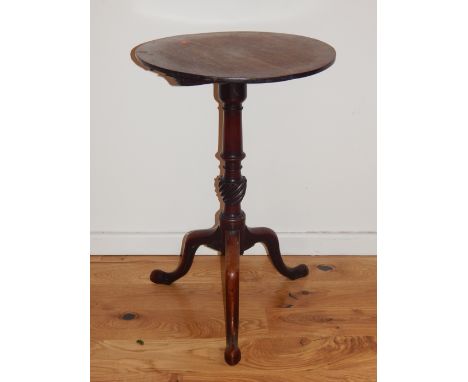 A George III mahogany wine table, the associated circular top above a turned support with spiral reeded knop and tripod base 