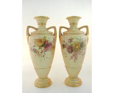 A pair of Royal Worcester vases, of baluster form with twin handles, decorated with vignettes of flowers on a blush ground, H