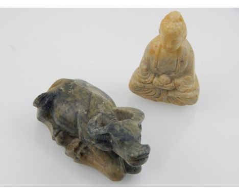 Two Chinese jade carvings, to include a study of a seated Buddha holding an orb, H. 6cm, and a prone oxen. L. 8.5cm (2)