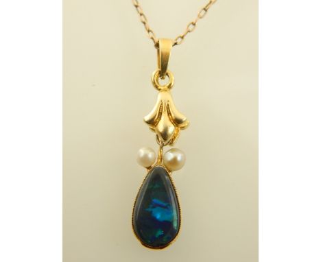 A yellow metal opal and pearl set drop pendant, suspended on a 9ct yellow gold chain. 