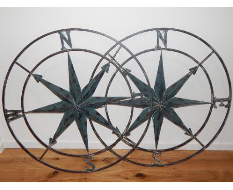 A pair of contemporary aged metal compass wall appliques. D. 105cm