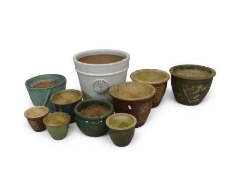 Ten various glazed ceramic and terracotta garden urns. Largest diameter 40cm, height 38cm.