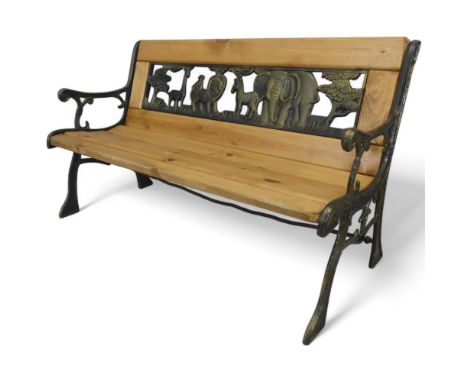 A pine slatted child's garden bench with cast iron ends and inset resin panel depicting animals. Length 90cm, height 50cm, de