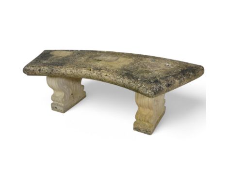 A three-section weathered concrete curved garden bench. Length 131cm, height 42cm, depth 56cm.