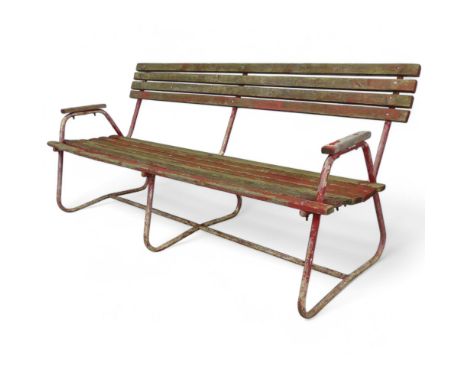 A Mid-Century weathered teak slatted garden bench with red painted tubular metal frame. Length 171cm, Height 77cm, Depth 70cm