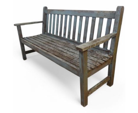 A Vintage painted and weathered teak slatted garden bench. Length 151cm, height 86cm, depth 57cm.