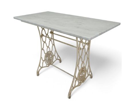 A marble topped garden table on cast iron frame, converted from a Singer sewing machine base. Length 107cm, height 76cm, widt