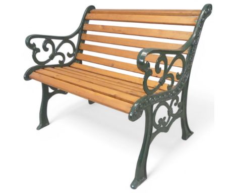A pine slatted garden bench with antique painted cast iron ends. Length 97cm, Height 77cm, depth 55cm.