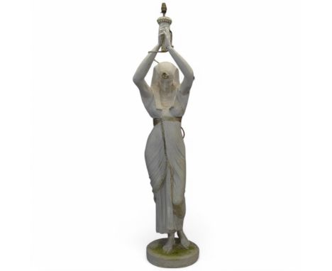 A vintage painted fibreglass figural lamp depicting an Egyptian female holding a sconce. Height 178cm.
