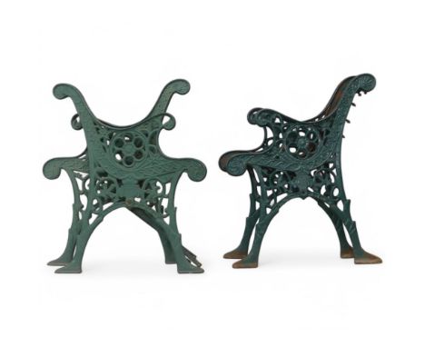 Two pairs of painted cast iron garden bench ends. Largest width 58cm, height 72cm.