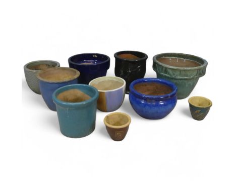 Ten various glazed terracotta and ceramic garden pots. Largest diameter 44cm, height 61cm.