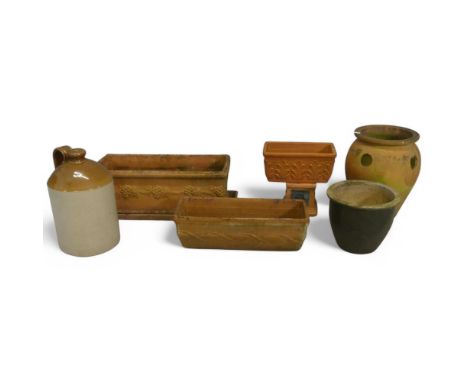 Six various terracotta and ceramic plant pots and a stoneware flagon. Tallest diameter 30cm, height 39cm.